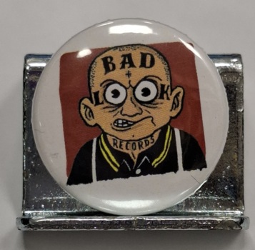 Przypinka. 83. Bad Look Records - logo
