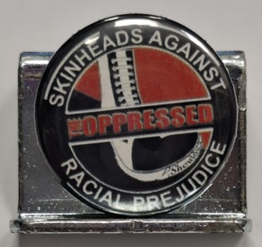 Przypinka. 56. Oppressed